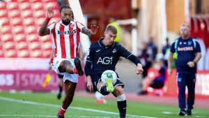 Swansea City’s Jay Fulton clears under pressure from Sorba Thomas in the opening day win at Stoke City.