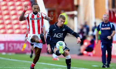 Swansea City’s Jay Fulton clears under pressure from Sorba Thomas in the opening day win at Stoke City.