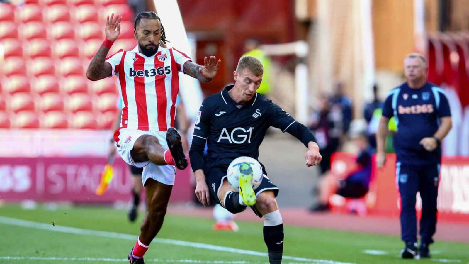 Swansea City’s Jay Fulton clears under pressure from Sorba Thomas in the opening day win at Stoke City.