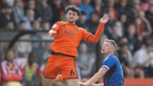 Salford City match-winner Joe Powell heads clear.