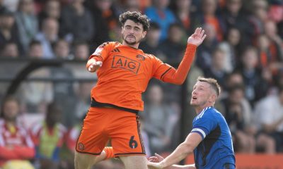 Salford City match-winner Joe Powell heads clear.