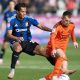 Swindon Town’s Kaelan Majekodunmi, left, challenges Salford City’s Ben Woodburn
