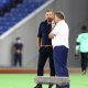 Peter Cklamovski, left, talks with Ange Postecoglou.