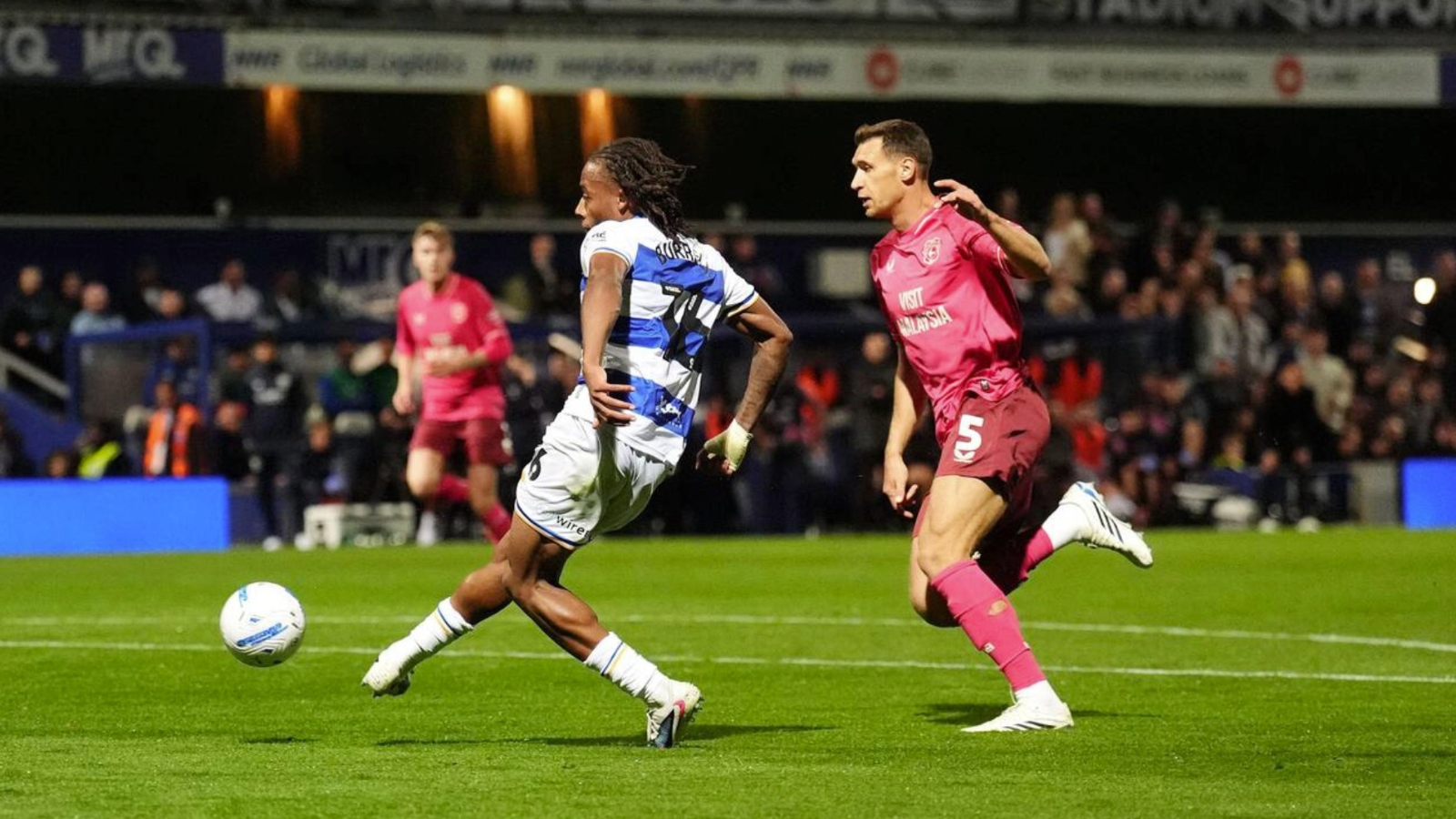 Rumarn Burrell scores his and QPR’s second in the 2-1 midweek win over Cardiff City at a bouncing Loftus Road.