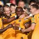 Shaquille Gwengwe, centre, takes the congratulations of his Newport County teammates.