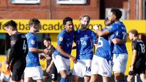 Stockport County’s Kyle Wootton, right, celebrates with team-mates