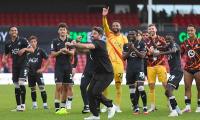 Swansea City and Vitor Matos celebrate their 2-1 victory over Lincoln City that sent them to the top of the Championship.