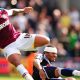 Millwall’s Tamika Mkandawire and West Ham United’s Julien Faubert battle for the ball at The Den in 2011