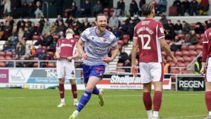 Will Keane celebrates scoring for Reading against Northampton Town last season.