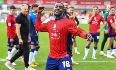 York City’s Jovan Malcolm celebrates with fans at full time