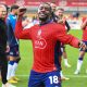 York City’s Jovan Malcolm celebrates with fans at full time