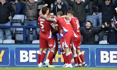 Millwall’s Camiel Neghli, facing, is mobbed by teammates after his winner.