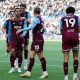 A relaxed Divine Mukasa celebrates his winner with his West Ham United team-mates.