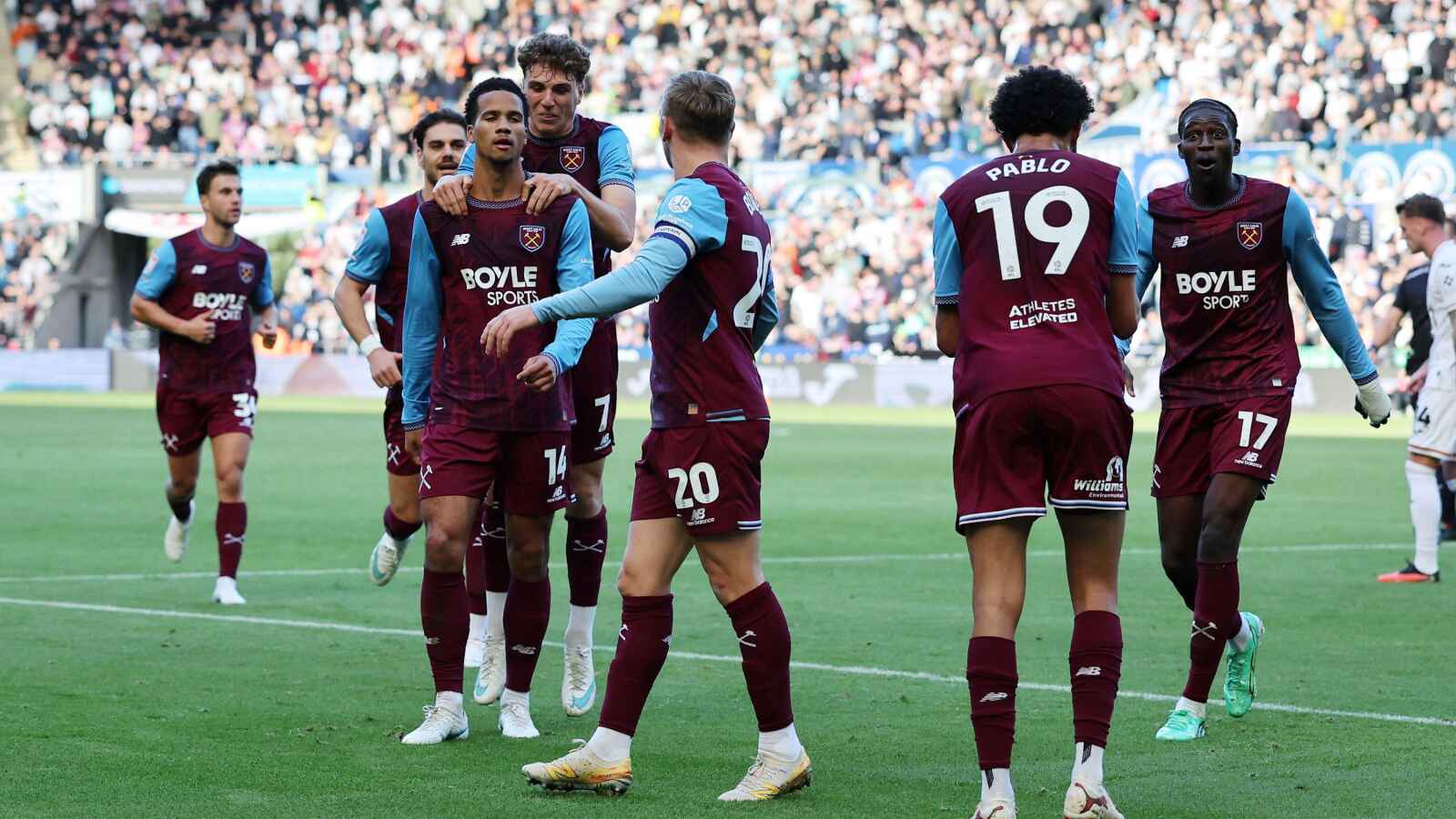 A relaxed Divine Mukasa celebrates his winner with his West Ham United team-mates.