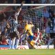 George Lloyd, centre, wheels away after giving Shrewsbury Town the lead.