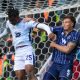 Lincoln City’s Deji Elerewe heads clear under pressure from Millwall defender Jake Cooper.