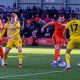 Salford City goalscorer Macaulay Langstaff is outnumbered