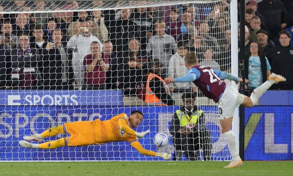 QPR keeper Pierce Charles plunges to his left to keep out Jarrod Bowen’s late spot-kick for West Ham.
