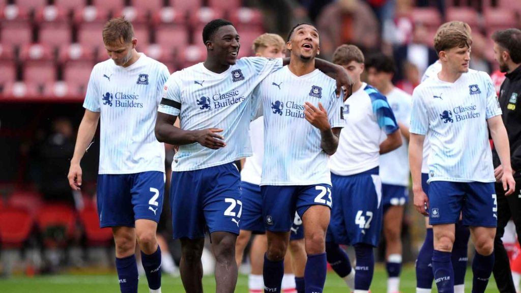 Plymouth Argyle goalscorer Bim Pepple, second from left, celebrates his opener with Bradley Ibrahim