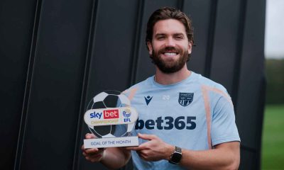 Sam Gallagher shows off his Goal of the Month trophy