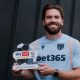 Sam Gallagher shows off his Goal of the Month trophy