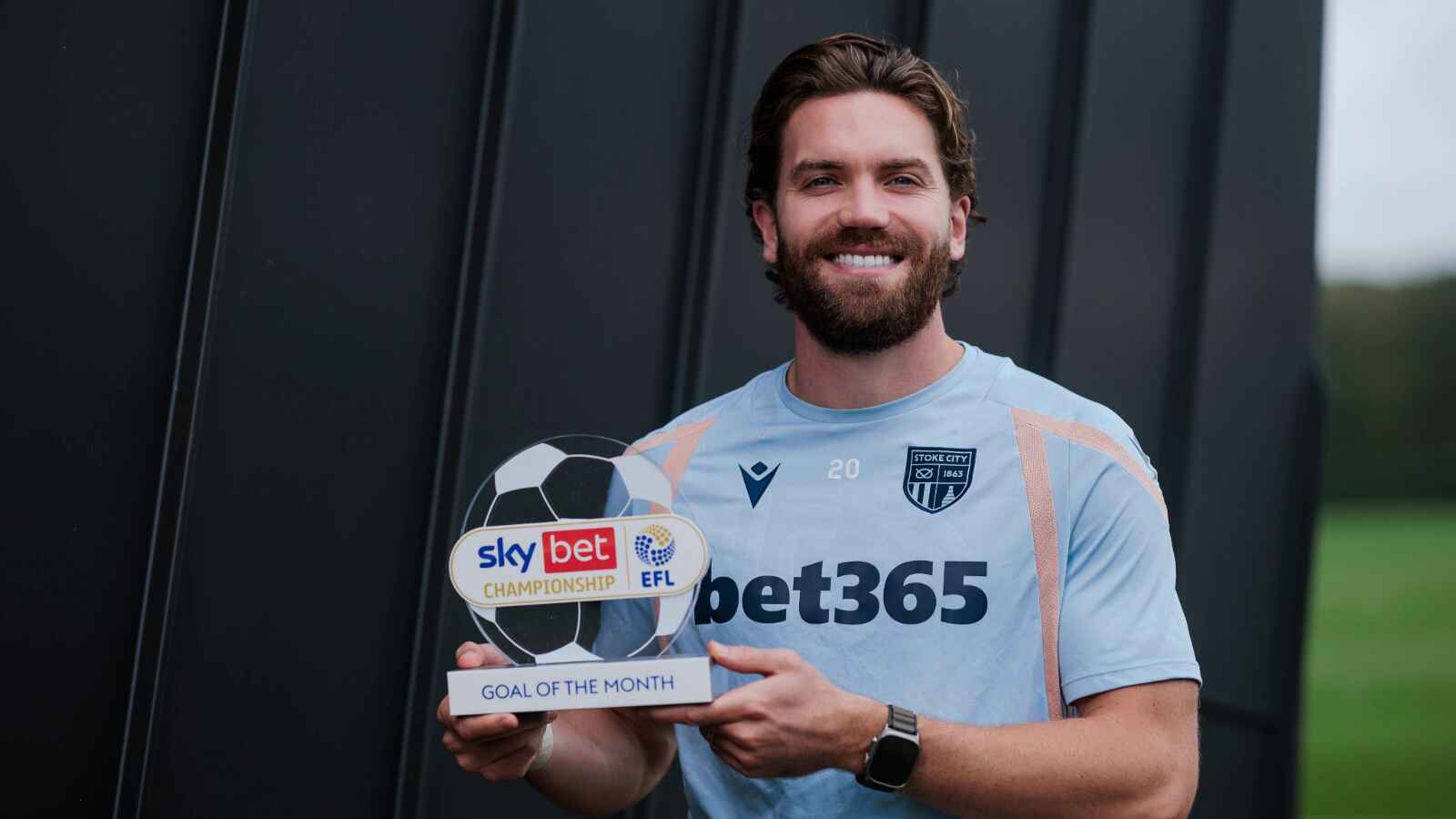 Sam Gallagher shows off his Goal of the Month trophy