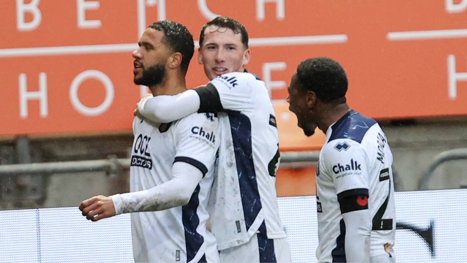 Tyler Roberts celebrates making it 4-1 to Mansfield Town
