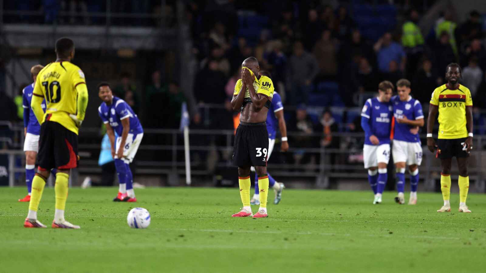 Watford players react after conceding a fourth goal in their 5-1 defeat to Cardiff City.
