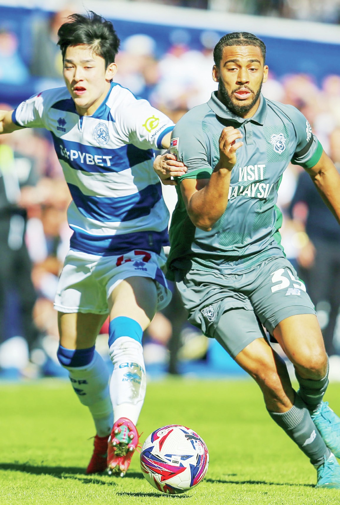 CLOSE ENCOUNTER: QPR’s Yang Min-hyeok and Cardiff’s Andy Rinomhota do battlePICTURES: Mike Griffiths