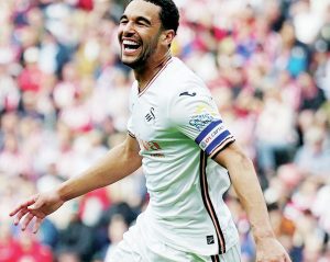 CAPTAIN MARVEL: Ben Cabango wheels away after grabbing Swansea’s goal PICTURES: Alamy