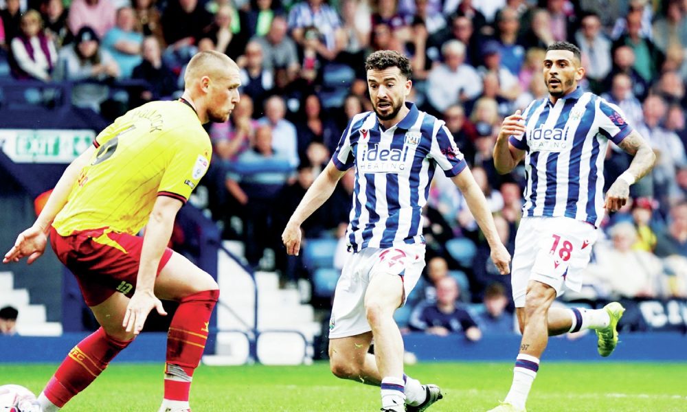 BREATHING SPACE: Mikey Johnston scores West Brom’s second goal against the Hornets PICTURE: Alamy