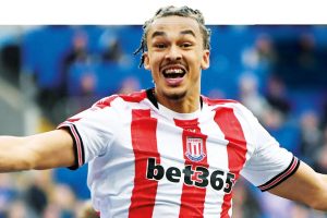 ALL SMILES: Stoke’s Ashley Phillips celebrates the late own goal that put his side on course for three points PICTURE: Alamy/Mike Griffiths