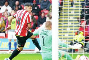 HERE WE GO: Sheffield United’s Gustavo Hamer scores the opener PICTURES: Alamy