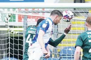 STARTER: Dominic Hyam rises high to head Blackburn into the lead PICTURES: Alamy