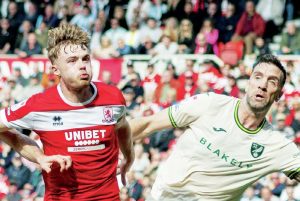 EYES FORWARD: Middlesbrough’s Tommy Conway battles for the ball with Norwich City’s Shane Duffy PICTURES: MI News & Sport