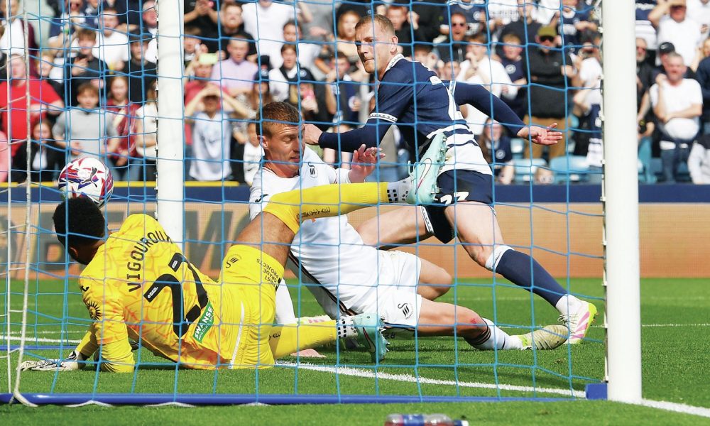 GORGEOUS GEORGE: Millwall’s George Saville forces the ball over the line to put his side into the lead PICTURES: Focus Images