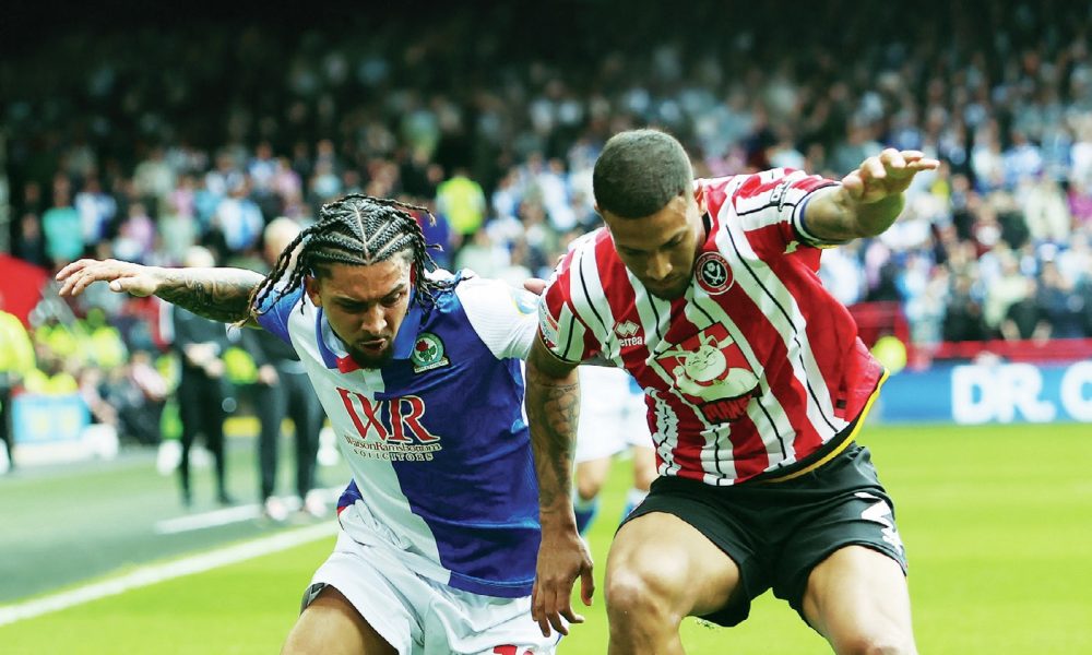 TUSSLE: Blackburn's Tyrhys Dolan, left, competes against Sheffield United's Vinicius Souza PICTURES; PSl/Craig Galloway