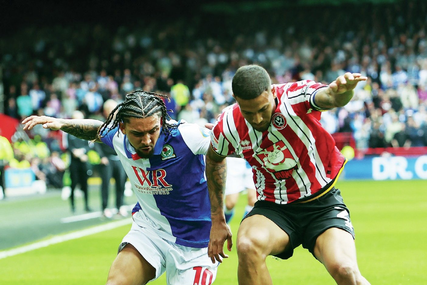 TUSSLE: Blackburn's Tyrhys Dolan, left, competes against Sheffield United's Vinicius Souza PICTURES; PSl/Craig Galloway