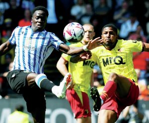 ON THE STRETCH: The Owls’ Djeidi Gassama, left, and Watford’s Yasser Larouci fight for the ball PICTURES: Alan Cozzi