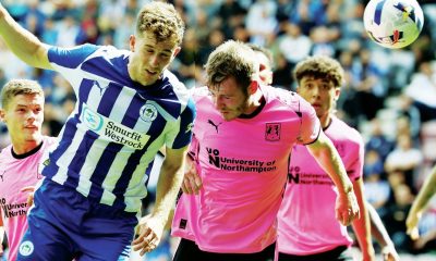 HEAD MASTER: Wigan’s Jensen Weir scores their second goal PICTURES: Alamy