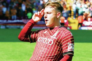 KNEESY DOES IT: Bobby Pointon celebrates his goal to double Bradford City’s lead PICTURES: Alamy