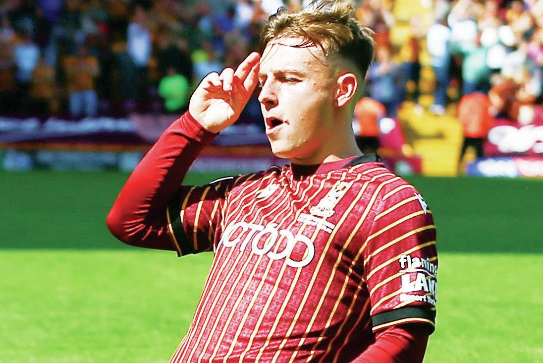 KNEESY DOES IT: Bobby Pointon celebrates his goal to double Bradford City’s lead PICTURES: Alamy