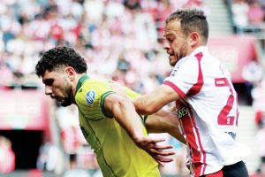 TUSSLE: Southampton’s Ryan Fraser, right, closes down Wrexham’s Liberato Cacace PICTURE: Alamy