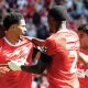 ALL SMILES: Charlton’s Harvey Knibbs, left, celebrates his late winner with his teammates PICTURES: Focus Images