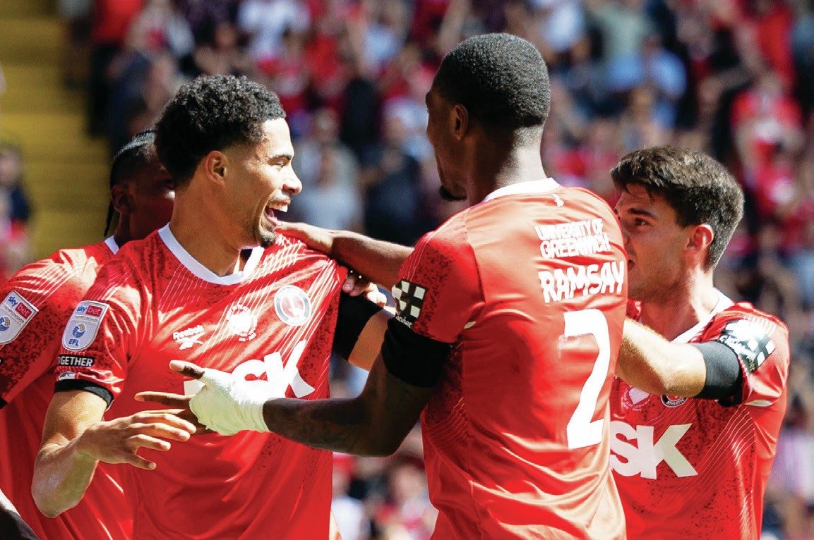 ALL SMILES: Charlton’s Harvey Knibbs, left, celebrates his late winner with his teammates PICTURES: Focus Images