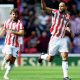 GAME ON: Stoke City’s Lewis Baker, right, celebrates scoring their leveller PICTURE: Alamy