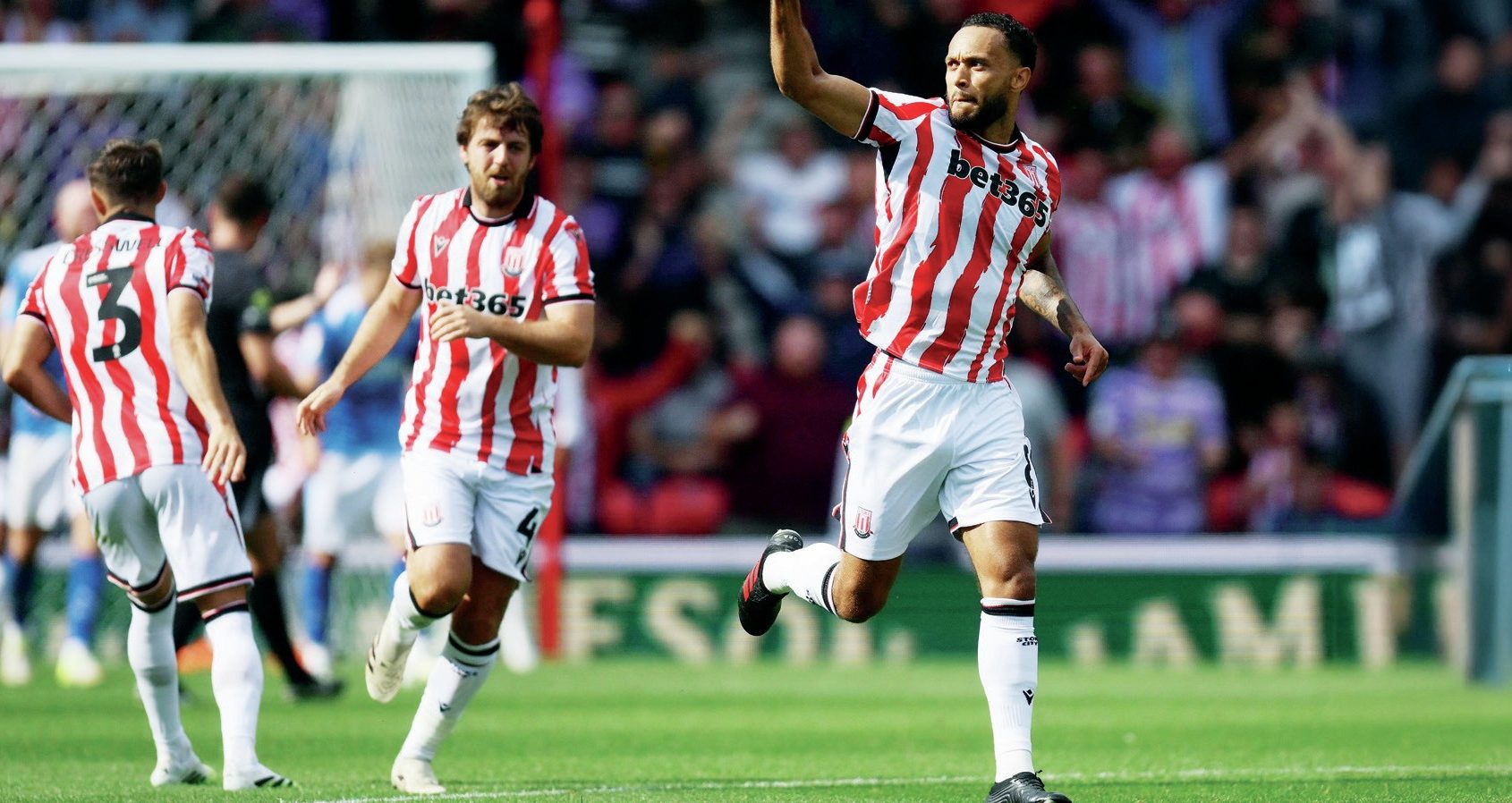 GAME ON: Stoke City’s Lewis Baker, right, celebrates scoring their leveller PICTURE: Alamy