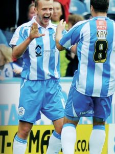 CLARK APPLAUDS
