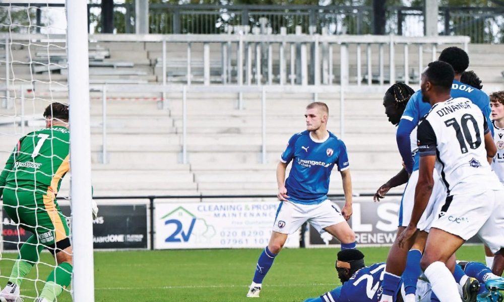 Chesterfield’s Chey Dunkley scores an own goal under pressure from Bromley’s Deji Elerewe