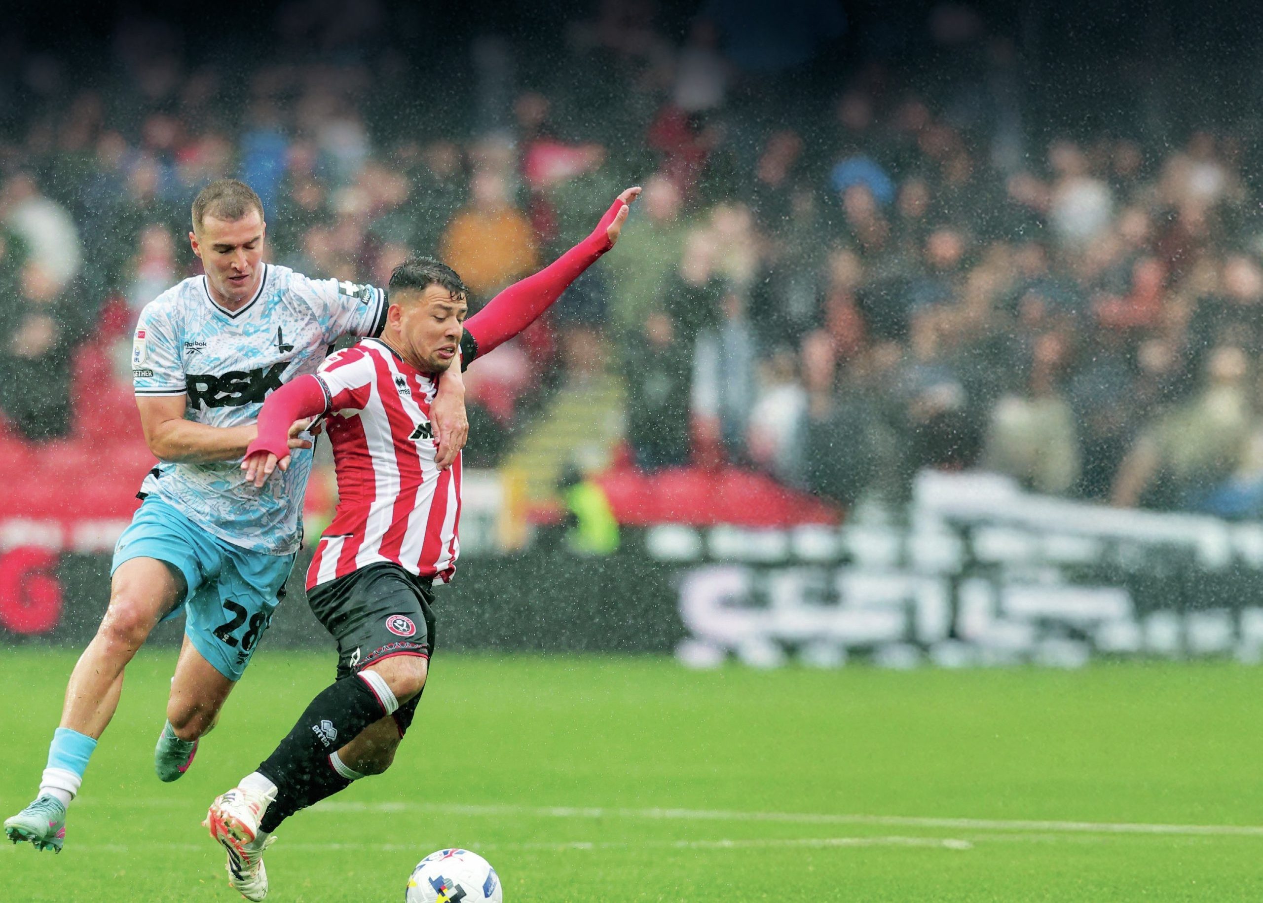 AT CLOSE QUARTERS: Charlton’s James Bree, left, gets to grips with Sheffield United’s Gustavo Hamer last weekend PICTURE: Alamy